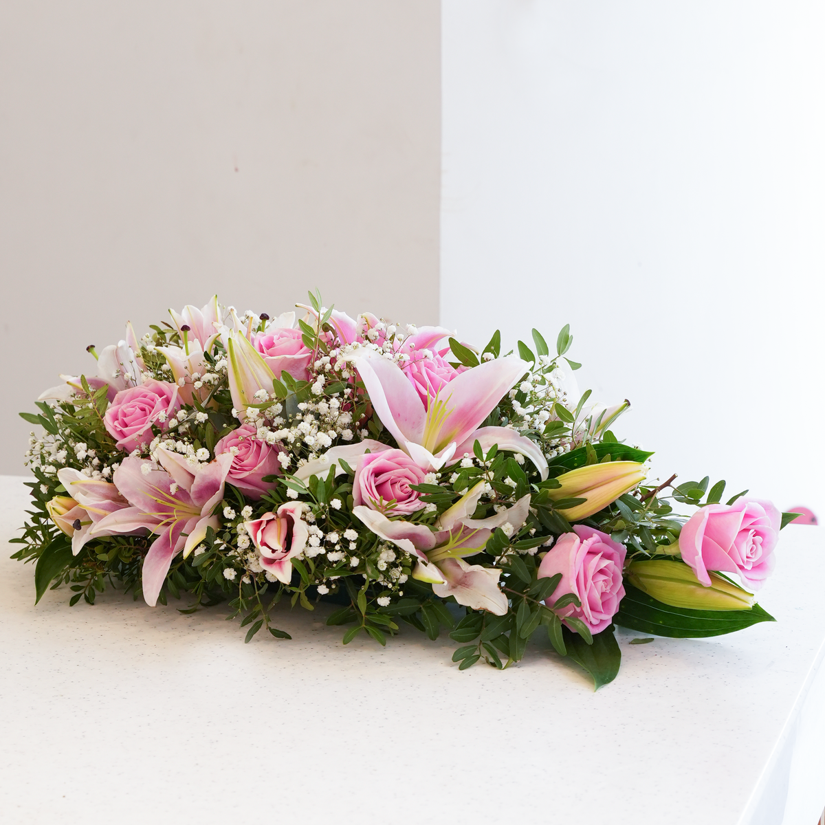
              Pink Roses and Pink Lily Funeral Spray